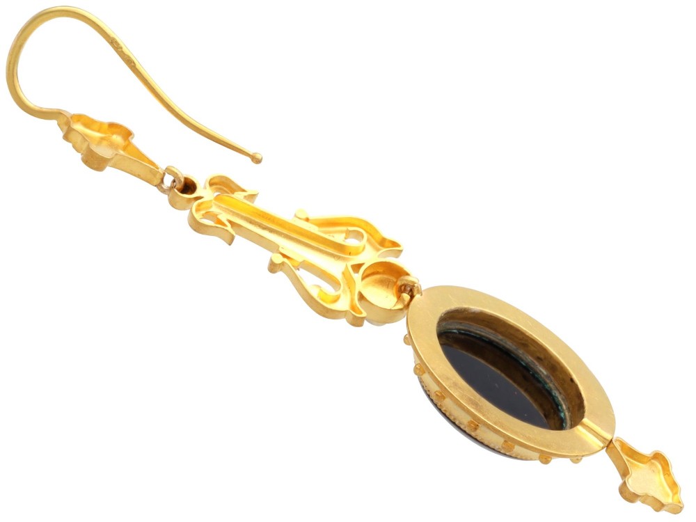 A pair of late Victorian 22ct yellow gold drop earrings featuring hand-carved hardstone cameo profile portraits and small seed pearls. View VII