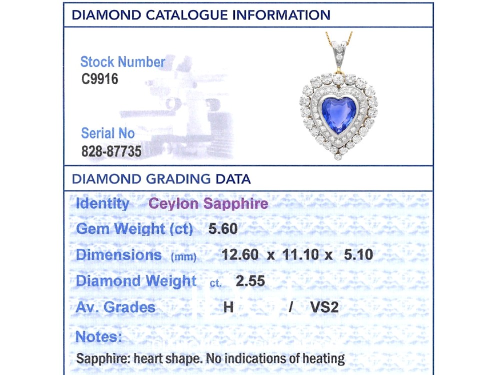 A heart-shaped 14ct yellow gold pendant featuring a central heart-cut Ceylon sapphire surrounded by a double halo of brilliant-cut diamonds. View XI