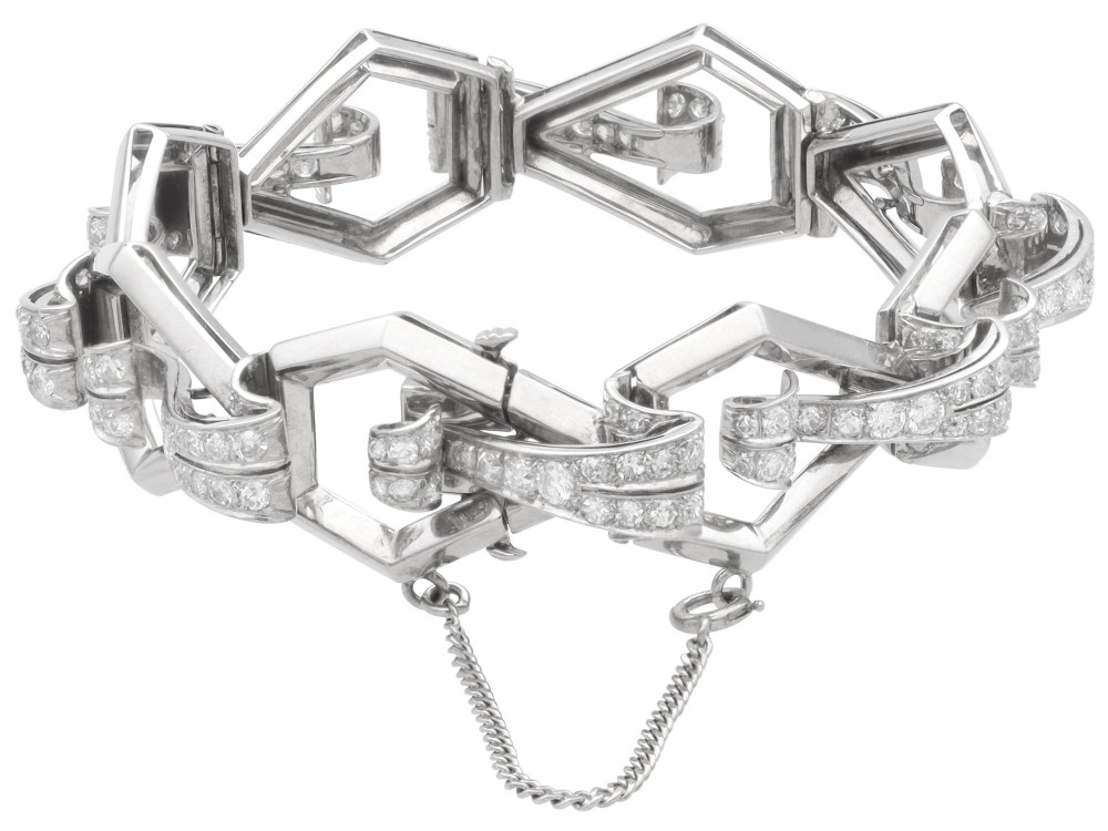 An Art Deco 18ct white gold link bracelet set with diamonds arranged in geometric openwork motifs. View XI