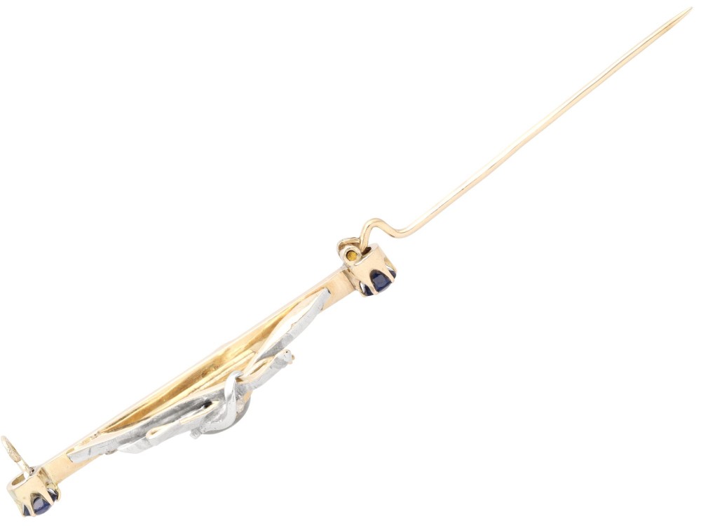 An antique Victorian 9ct gold bar brooch featuring a central swan motif set with diamonds and an oval opal body, flanked by two blue sapphires. View VIII