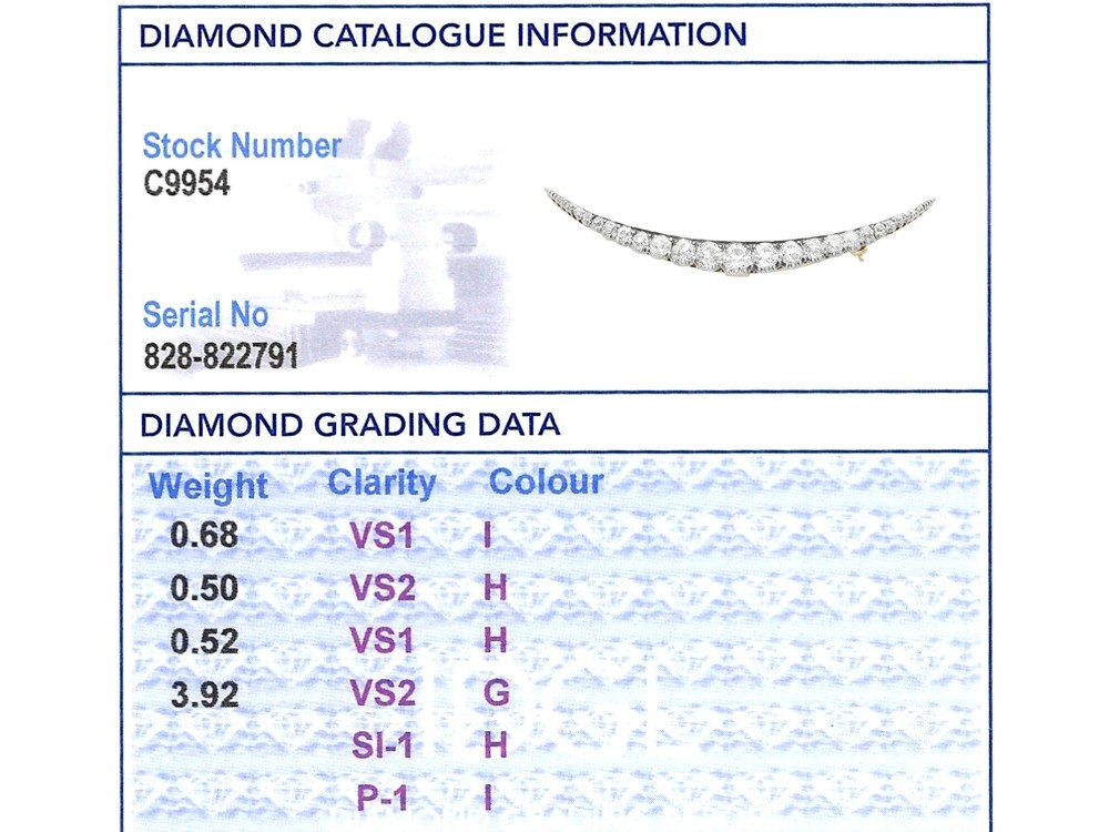 An antique crescent-shaped brooch set with a row of graduated diamonds mounted in gold and silver. View XII