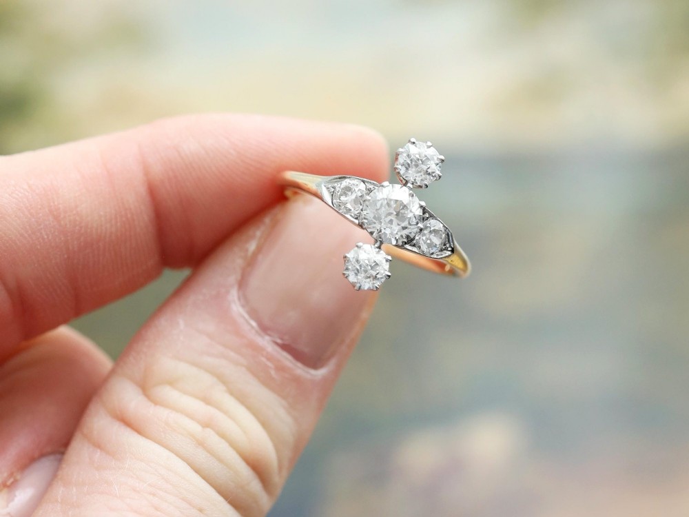 An antique 18ct yellow gold ring featuring five old-cut diamonds set in a geometric white metal arrangement. View III