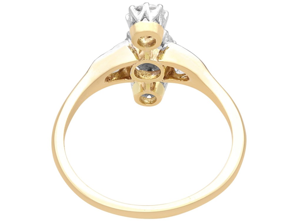 An antique 18ct yellow gold ring featuring five old-cut diamonds set in a geometric white metal arrangement. View VIII