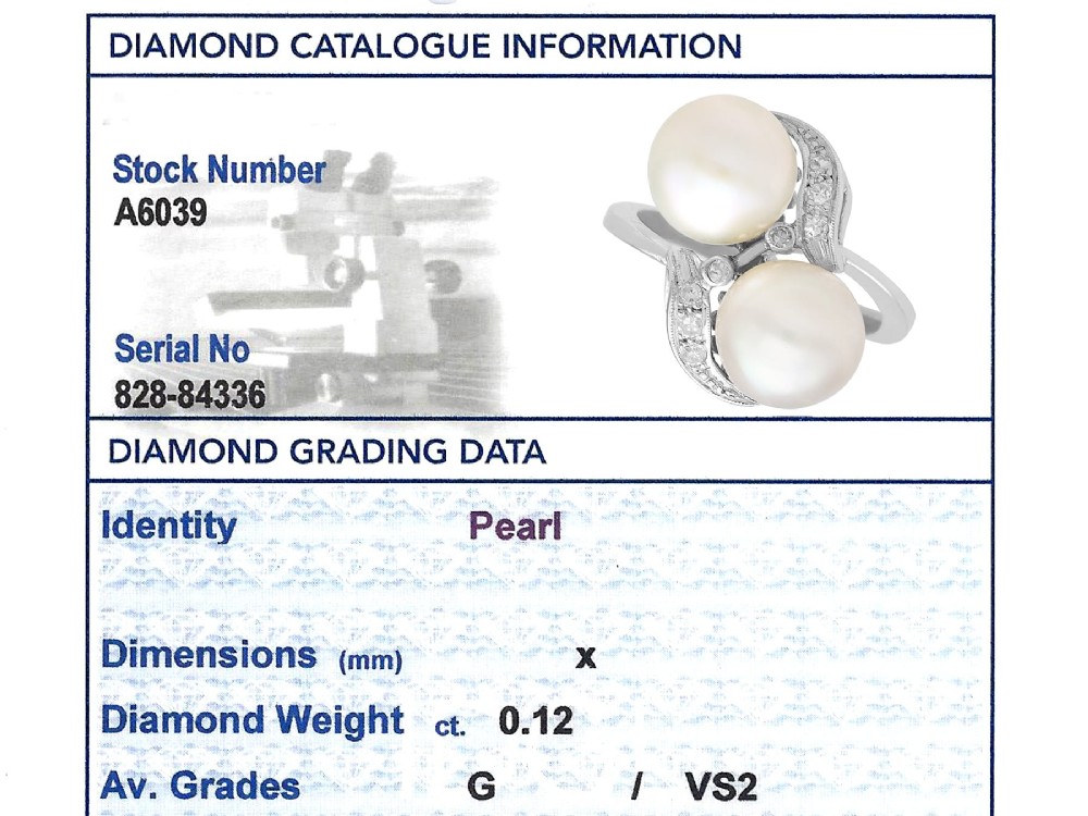 A circa 1950 white gold crossover cocktail ring featuring two cultured pearls flanked by diamond-accented bypass shoulders. View X