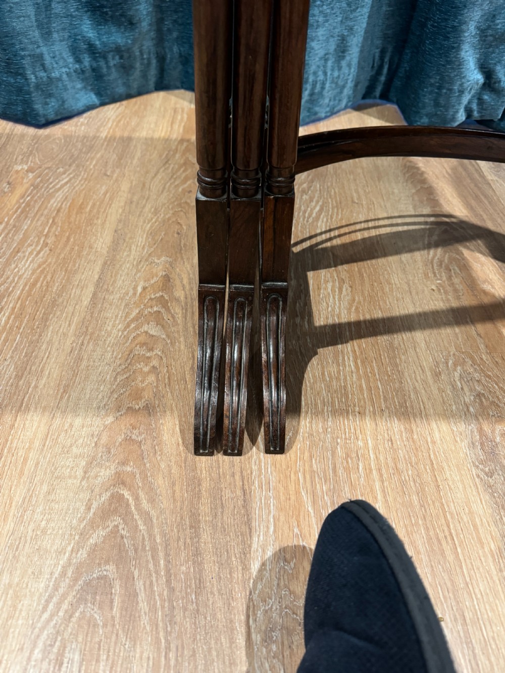 A set of three graduated Regency rosewood nesting side tables with slender turned legs and curved stretchers. View VI