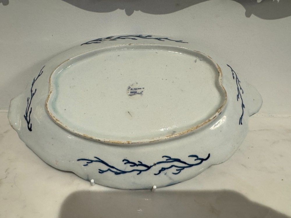 A pair of oval 18th-century English Bow porcelain serving dishes decorated with underglaze blue vine leaves, grapes, and insects. View VII
