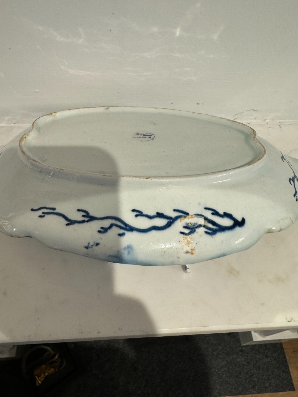 A pair of oval 18th-century English Bow porcelain serving dishes decorated with underglaze blue vine leaves, grapes, and insects. View IX