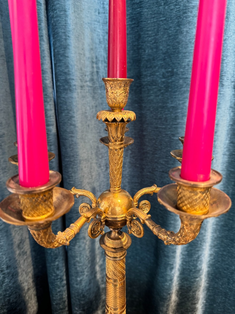 A pair of French Empire ormolu five-branch candelabra featuring intricate engine-turned decoration and square plinth bases. View VIII