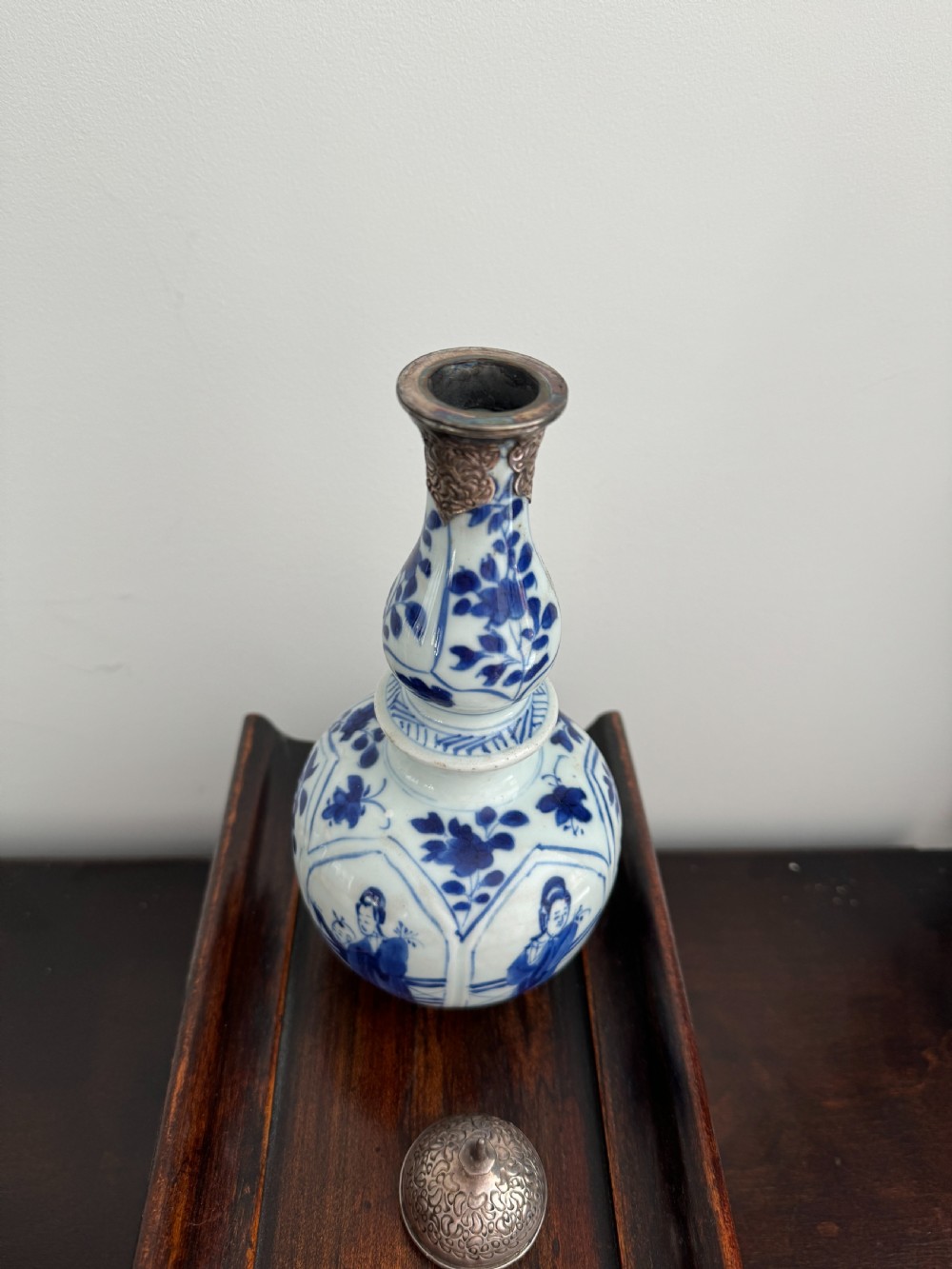 A Chinese Kangxi period underglaze blue and white porcelain vase decorated with figural panels and topped with an engraved silver Islamic mount. View IV