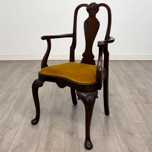 fig 1. A set of six dark mahogany dining chairs featuring cabriole legs, carved back splats, and gold velvet drop-in seats.