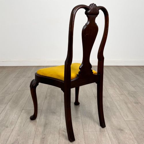 fig 3. A set of six dark mahogany dining chairs featuring cabriole legs, carved back splats, and gold velvet drop-in seats.