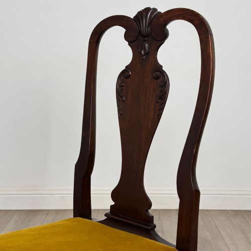 fig 4. A set of six dark mahogany dining chairs featuring cabriole legs, carved back splats, and gold velvet drop-in seats.