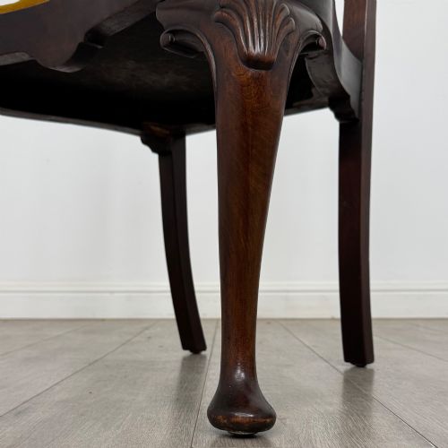 fig 6. A set of six dark mahogany dining chairs featuring cabriole legs, carved back splats, and gold velvet drop-in seats.