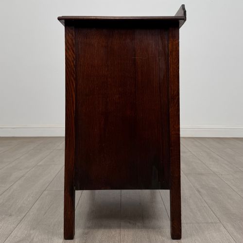 fig 2. An Edwardian oak chest of drawers featuring three full-width drawers with circular pull handles, supported by straight square legs.