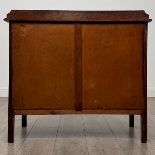 fig 4. An Edwardian oak chest of drawers featuring three full-width drawers with circular pull handles, supported by straight square legs.