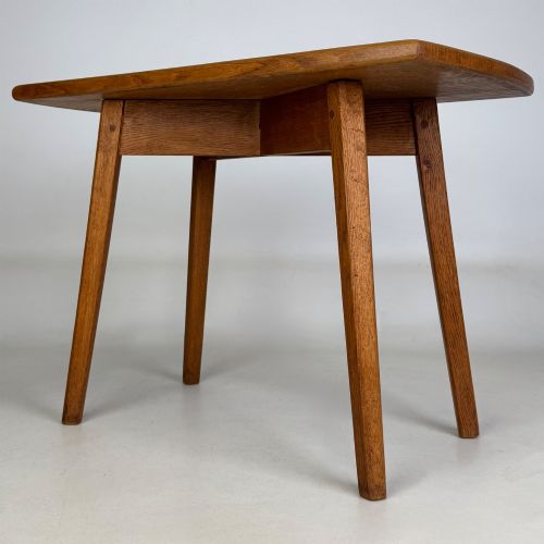 fig 1. A rectangular golden oak coffee table with tapered splayed legs and visible wooden peg joinery.
