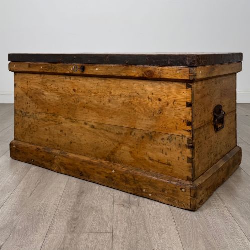 fig 1. A nineteenth-century pine storage chest featuring visible hand-cut dovetail corner joints and a moulded base.