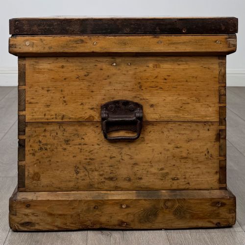 fig 2. A nineteenth-century pine storage chest featuring visible hand-cut dovetail corner joints and a moulded base.