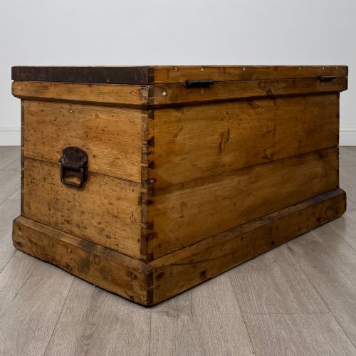 fig 3. A nineteenth-century pine storage chest featuring visible hand-cut dovetail corner joints and a moulded base.