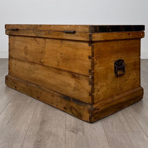 fig 5. A nineteenth-century pine storage chest featuring visible hand-cut dovetail corner joints and a moulded base.