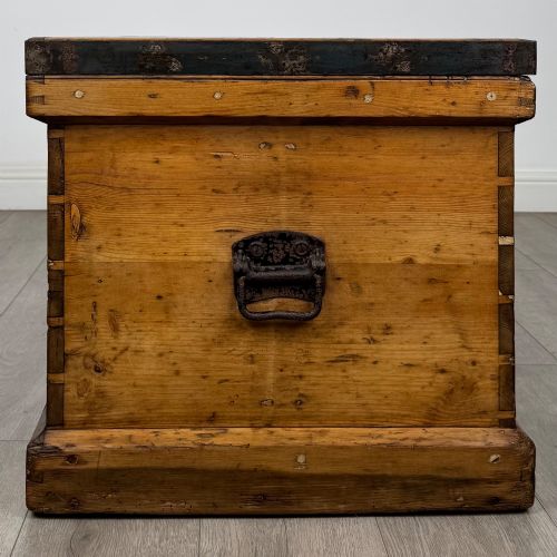 fig 6. A nineteenth-century pine storage chest featuring visible hand-cut dovetail corner joints and a moulded base.