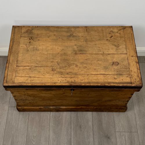 fig 8. A nineteenth-century pine storage chest featuring visible hand-cut dovetail corner joints and a moulded base.