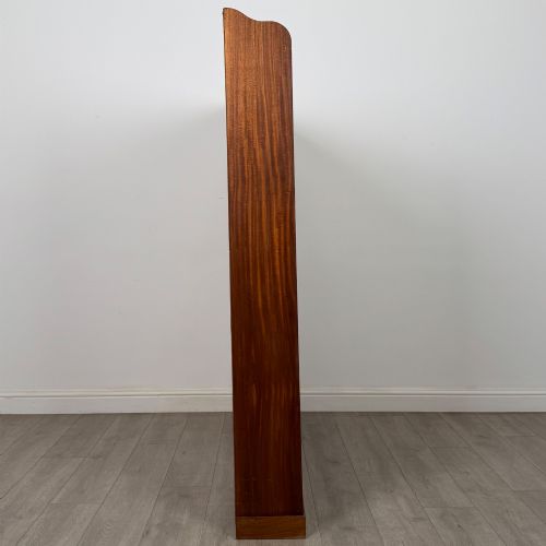 fig 6. A large twentieth-century open walnut bookcase featuring multiple fixed shelves with a central divider on the lower section.