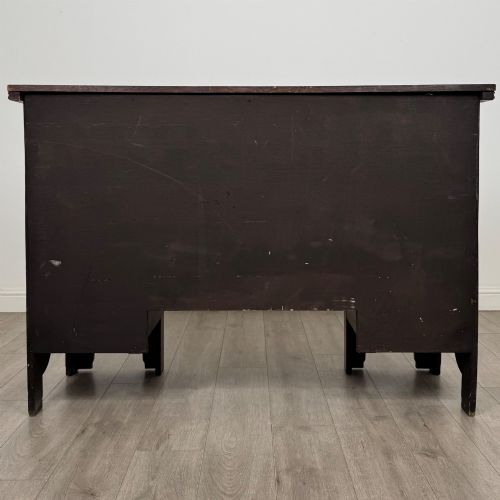fig 5. A dark oak Gothic Revival sideboard featuring three central drawers with metal drop ring handles, flanked by two carved tracery panel doors with decorative iron latches.