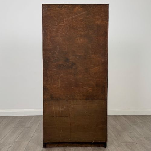 fig 6. A tall vintage golden oak display cabinet featuring glazed sliding doors on top and a two-door cupboard base.