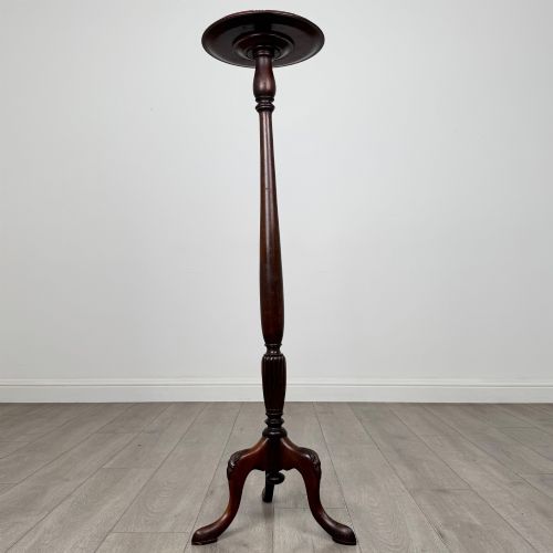 fig 1. A tall 19th-century Georgian style mahogany torchere stand featuring a circular dished top, turned column, and carved tripod cabriole legs.