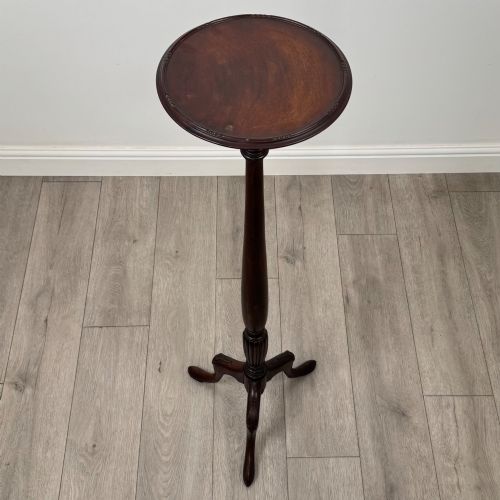 fig 2. A tall 19th-century Georgian style mahogany torchere stand featuring a circular dished top, turned column, and carved tripod cabriole legs.