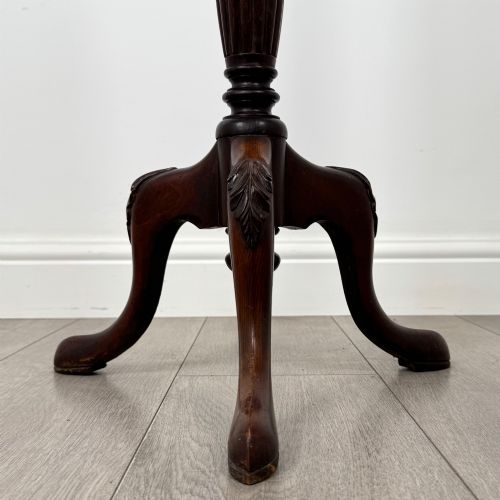 fig 5. A tall 19th-century Georgian style mahogany torchere stand featuring a circular dished top, turned column, and carved tripod cabriole legs.