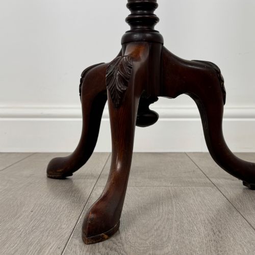 fig 6. A tall 19th-century Georgian style mahogany torchere stand featuring a circular dished top, turned column, and carved tripod cabriole legs.
