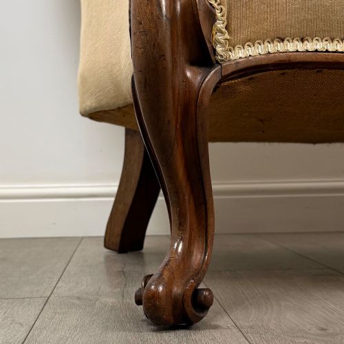 fig 9. A Victorian mahogany chaise longue featuring ochre velvet button-backed upholstery, carved trim, and cabriole legs.
