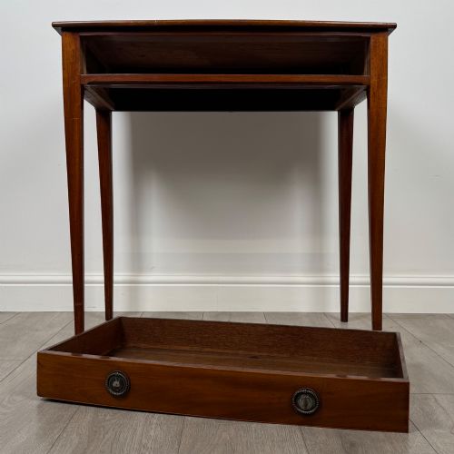 fig 9. An 18th-century Georgian mahogany writing table featuring a single full-width drawer with two circular brass handles and tapered square legs.