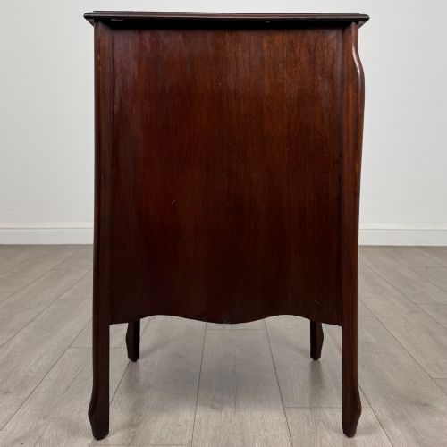 fig 7. An antique Edwardian mahogany cabinet with double panelled doors, brass knobs, and elevated curved legs.