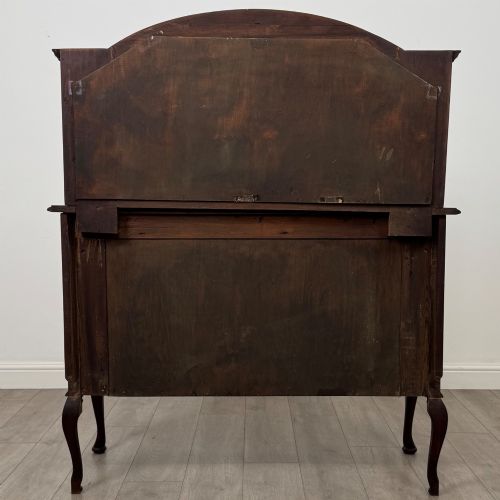 fig 5. An antique Edwardian mahogany sideboard featuring a top section with a central oval mirror, two drawers, and a two-door cabinet below raised on cabriole legs.
