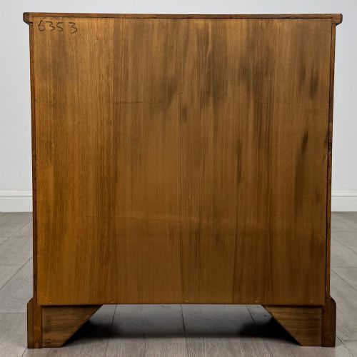 fig 4. A small 20th-century open oak bookcase featuring two drawers at the top with dark twisted ring handles above two open shelves.