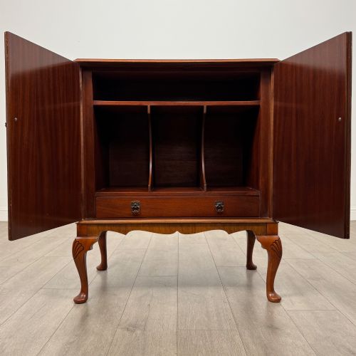 fig 1. A 20th-century burr walnut two-door fitted cabinet on cabriole legs with carved shell knees and decorative pierced brass hinges.