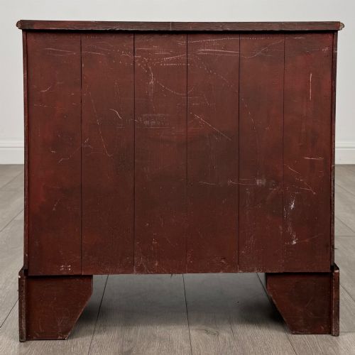 fig 4. An antique oak chest of drawers featuring two short over three long drawers with brass swan-neck handles and shaped bracket feet.