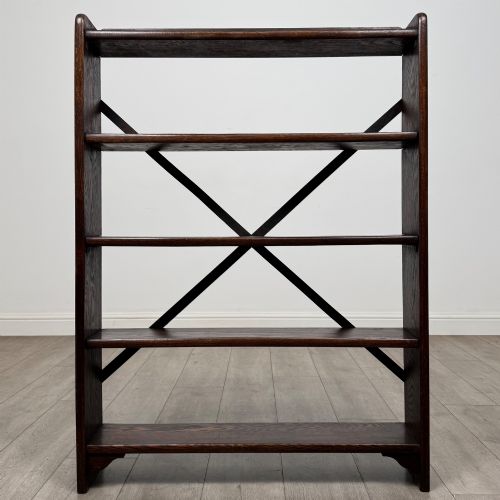 fig 1. A dark oak open bookcase featuring five shelves and a black metal rear X-brace.