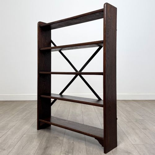 fig 2. A dark oak open bookcase featuring five shelves and a black metal rear X-brace.