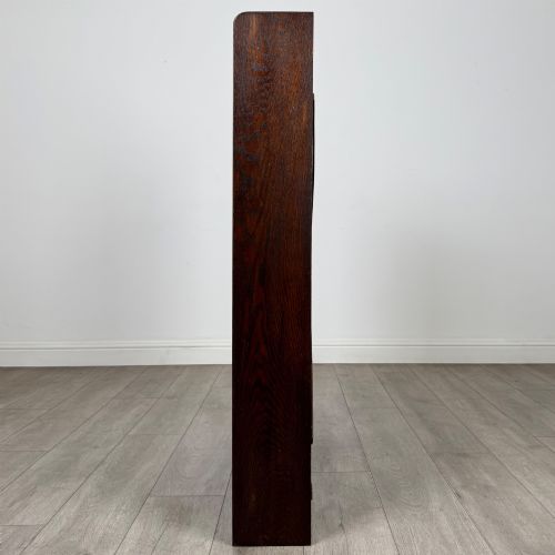 fig 3. A dark oak open bookcase featuring five shelves and a black metal rear X-brace.
