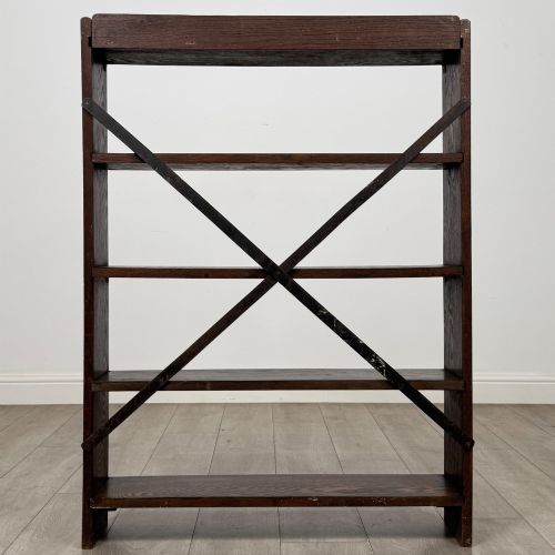 fig 5. A dark oak open bookcase featuring five shelves and a black metal rear X-brace.