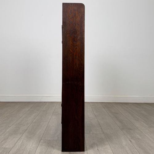 fig 7. A dark oak open bookcase featuring five shelves and a black metal rear X-brace.