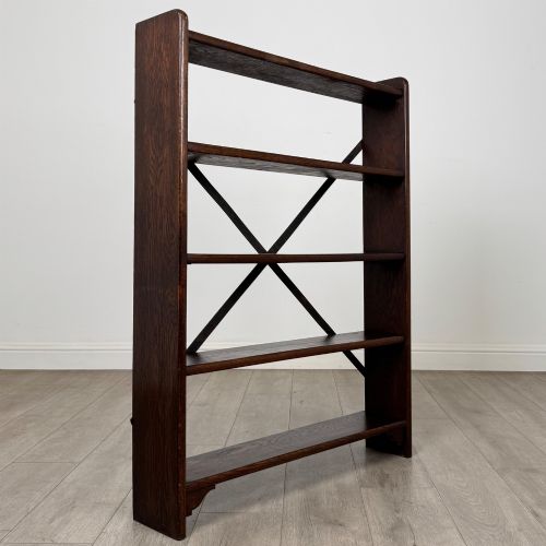 fig 8. A dark oak open bookcase featuring five shelves and a black metal rear X-brace.