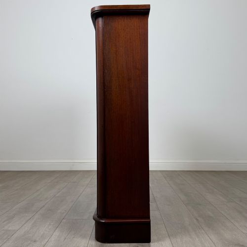 fig 3. An antique 19th-century Victorian mahogany open bookcase featuring four tier shelves, rounded front corners, and a solid plinth base.