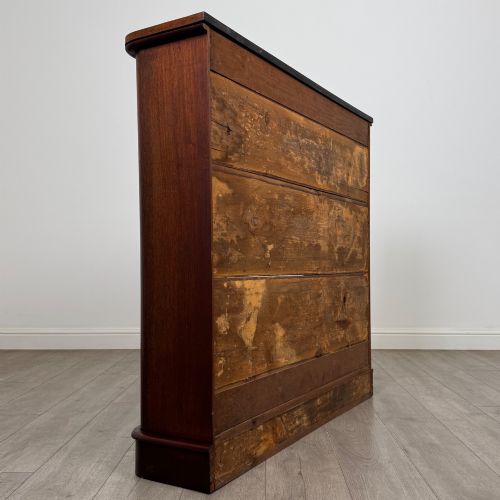 fig 4. An antique 19th-century Victorian mahogany open bookcase featuring four tier shelves, rounded front corners, and a solid plinth base.