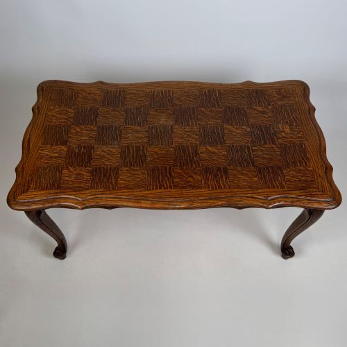 fig 8. A 20th-century dark oak coffee table featuring cabriole legs, a serpentine apron, and a central carved shell motif.