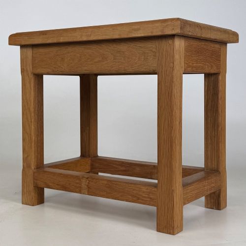 fig 1. A solid oak rectangular joint stool featuring visible wooden dowel joinery and a sturdy base with lower stretchers.